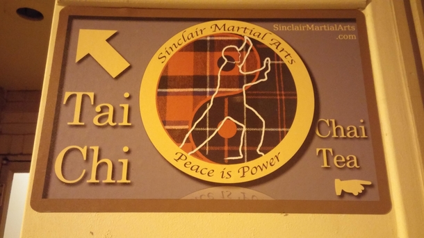 Clever sign between a dojo and a coffee shop in my hometown