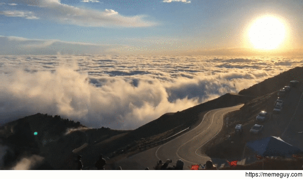 Clouds crashing into pikes peak like waves in the ocean