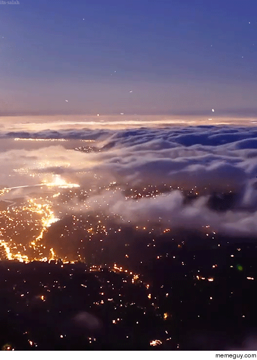 Clouds over city lights