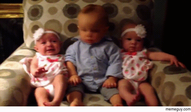 Confused baby meets twins