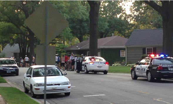 Cops pull over and ticket  bicyclists at once for running a stop sign
