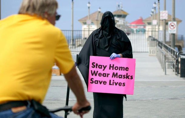 Counter protestor at Huntington Beach CA dressed up as a grim reaper