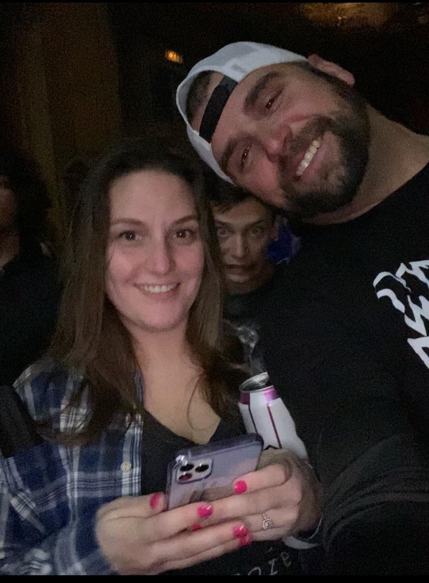 Crazy guy photobombing my girlfriend and I at a concert