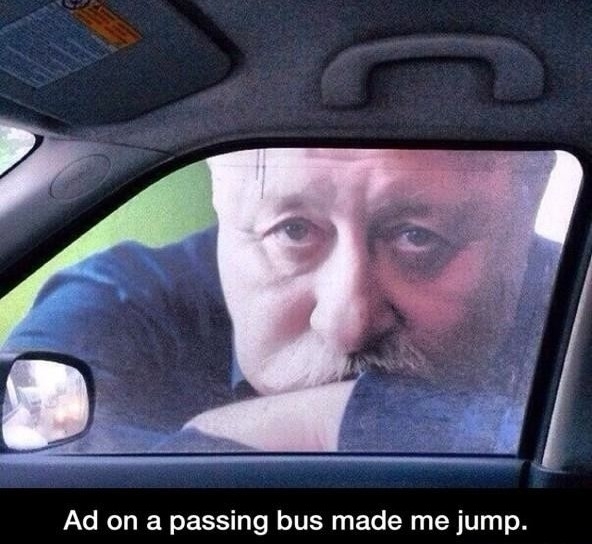 Creepy window poster guy