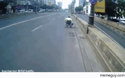 Cyclist helps struggling man in a wheelchair up a hill