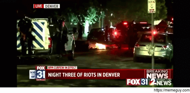 Denver cop seen pushing a reporter into a fire