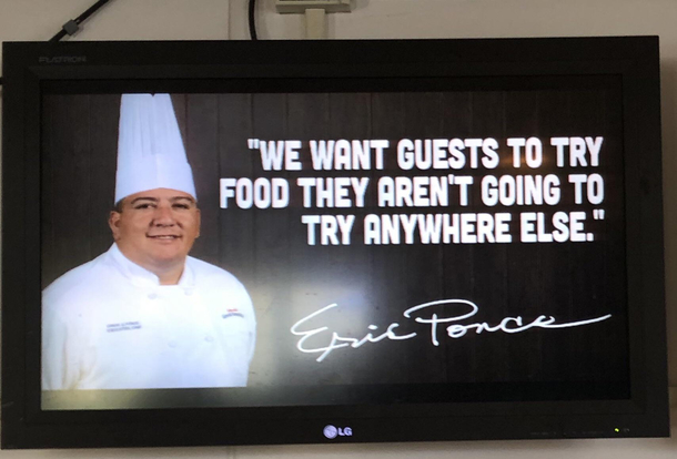 Display at amusement park restaurant that serves chicken fingers fries and pizza