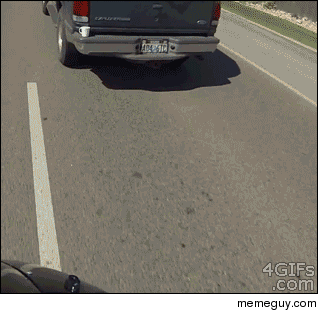 Driver mugged by a passing motorcyclist