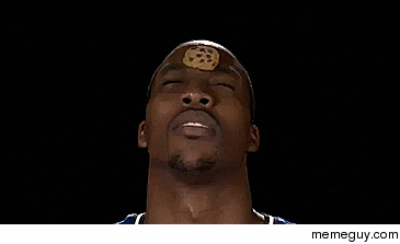 Dwight Howard eating a cookie placed on his forehead