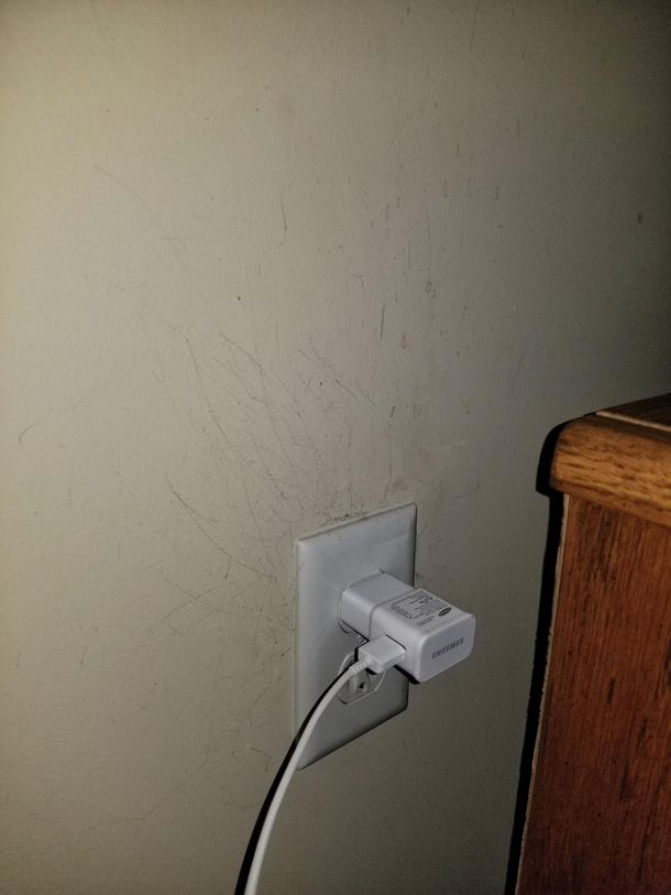 Every night before bed I turn the lights off and then blindly plug my phone in I guess my aim isnt too good