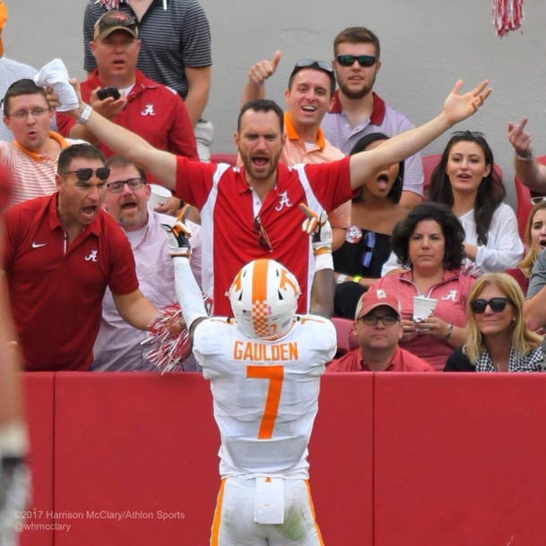 Football player flipping off the crowd after scoring a touchdown Every fans reaction is different