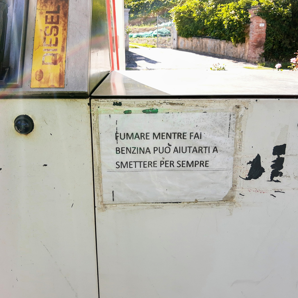 Found at a gas pump in Italy it says smoking while refueling can help you quitting smoking forever