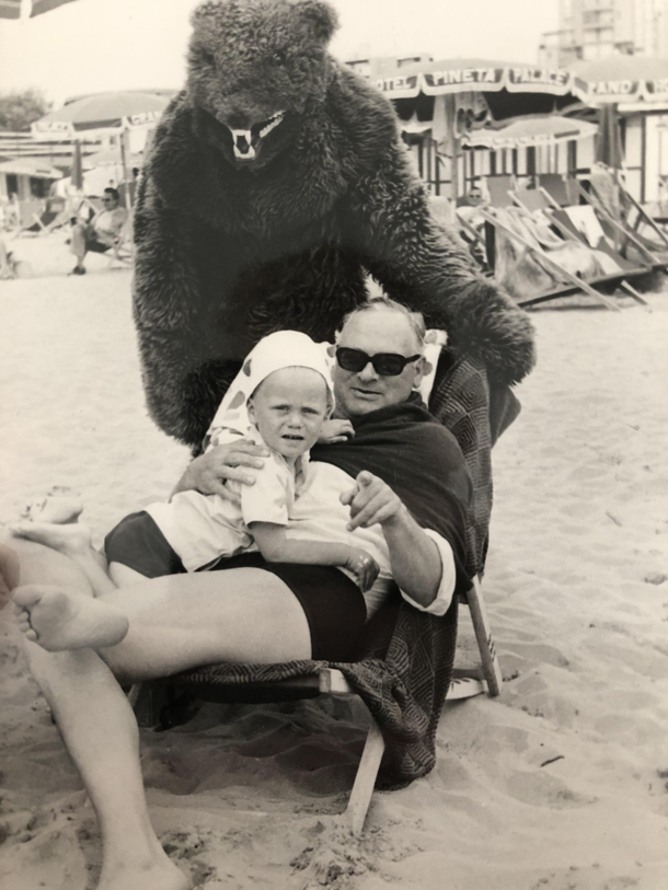 Found this picture of my dad and my grandfather at the beach I wonder why he looks so scared