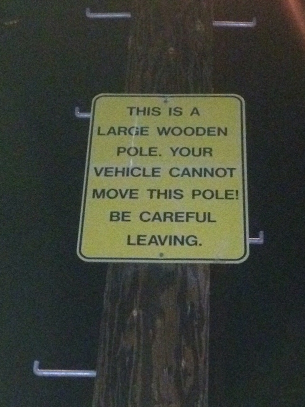 Found this sign behind a bar attached to a large wooden pole