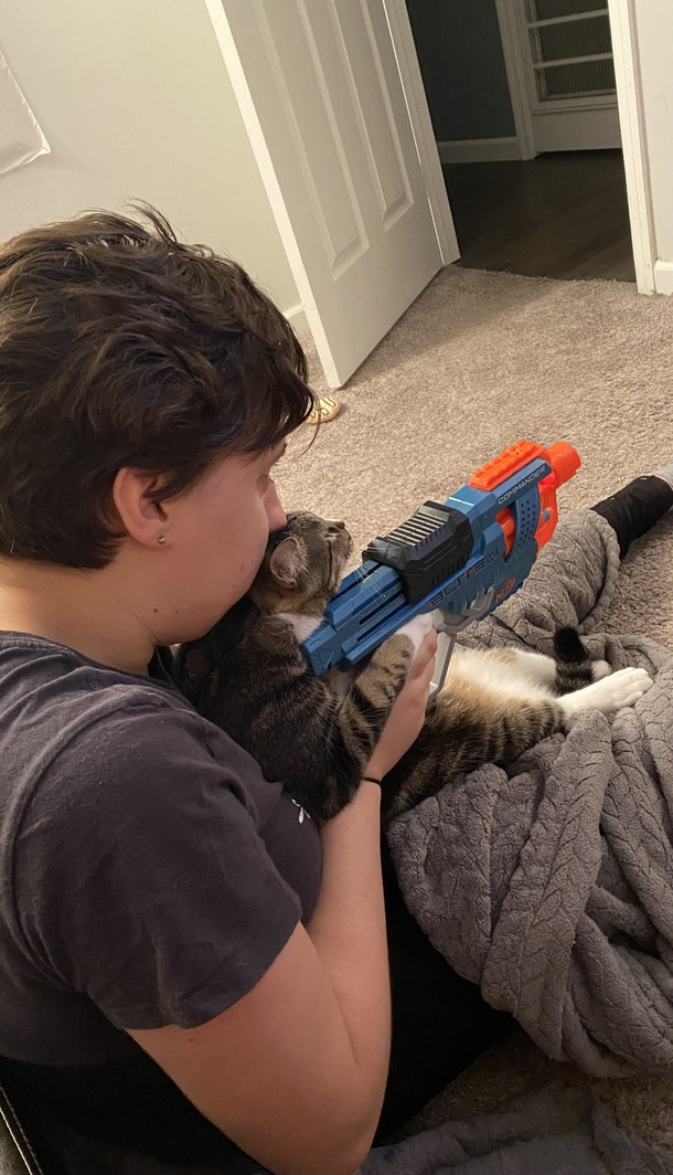 Gf teaching cat how to shoot