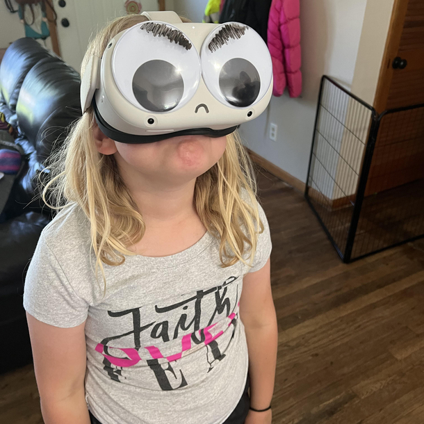 Googly eyes on a VR headset turned very angry with the help a dry erase marker