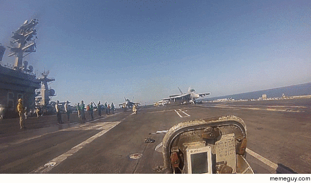 Green Shirts On The Deck Of A Carrier Have A Terrifying Job