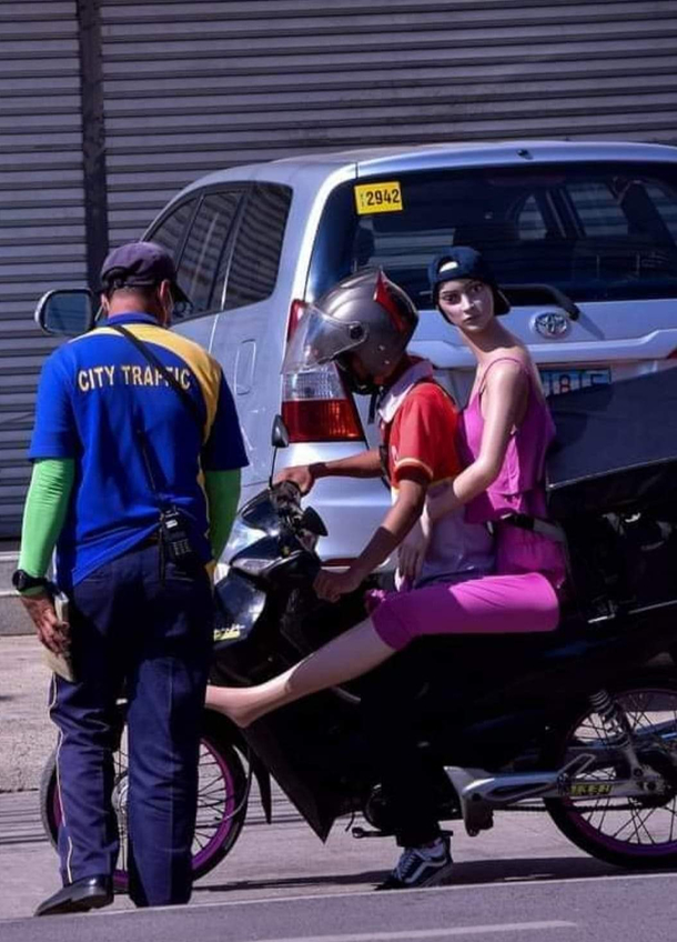 guy got pulled over because his passenger wasnts wearing a helmet