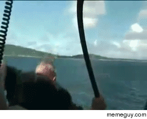 Guy jumps out of helicopter and catches a large fish
