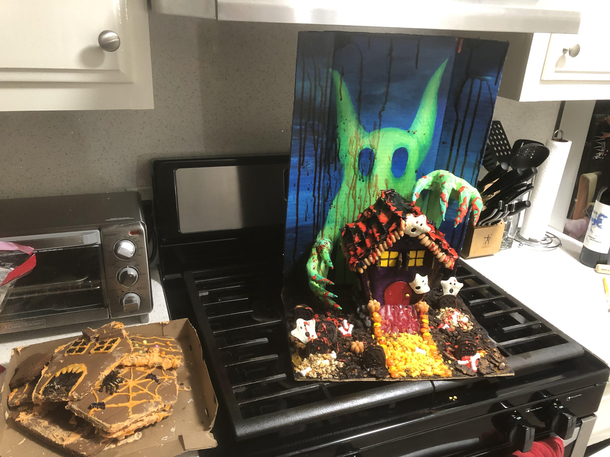 Had a haunted gingerbread house competition with my roommate Im on the left