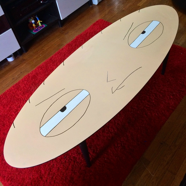 Had an old oval shaped coffee table with a messed up top so I painted it into something I thought the shape was perfect for OC