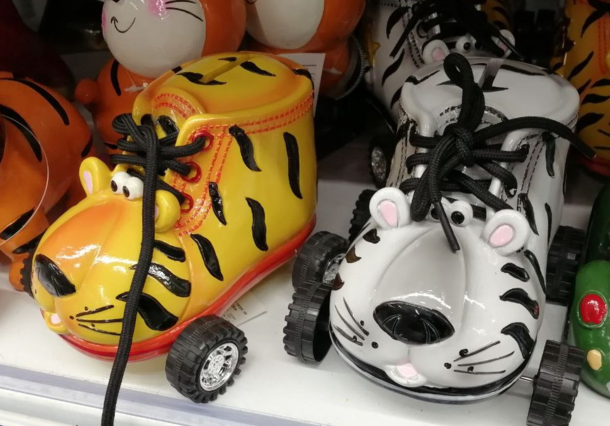 Have you ever seen a tiger piggy bank in the form of a boot on wheels Now you have
