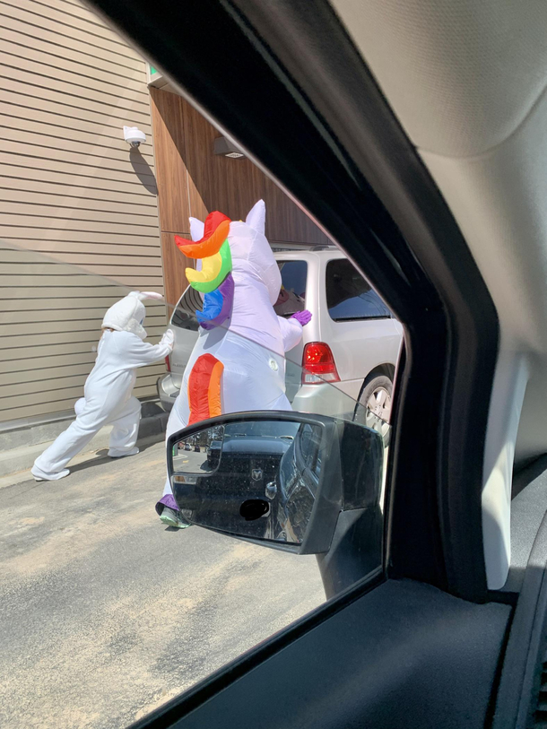 Hazmat suits used by bank employees to move a dead van out of a drive thru lane