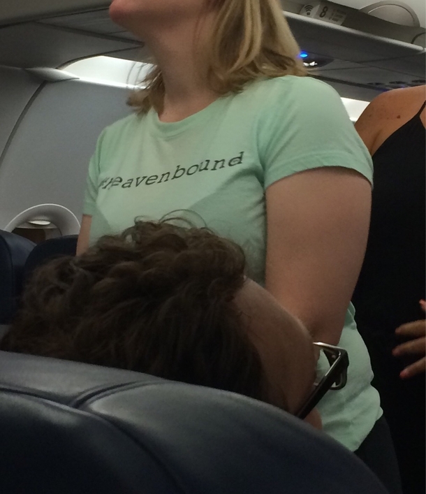 Her shirt says Heavenbound Literally one of the last shirts you want to see on your flight