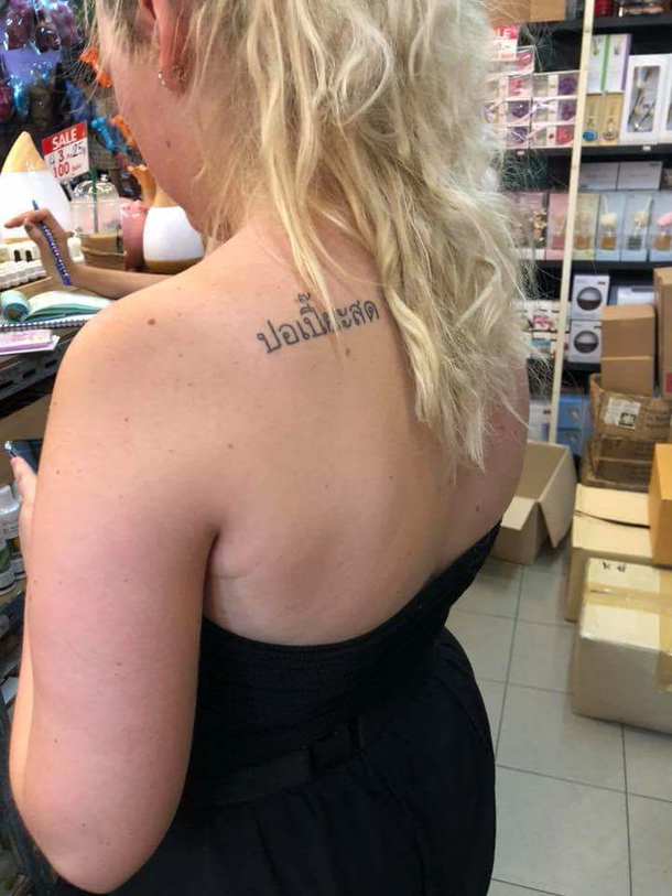 Her tattoo says fresh spring rolls in Thai