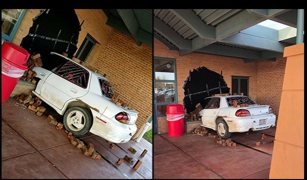 High School Senior Prank makes it look like a car crashed into the school using black tarp some bricks and a car cut in half