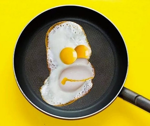 Homer Simpson using the medium of fried eggs