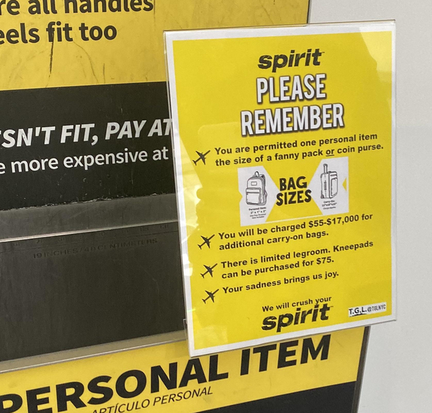 Honest Spirit Airlines signs put up at the airport TGLNYC on IG
