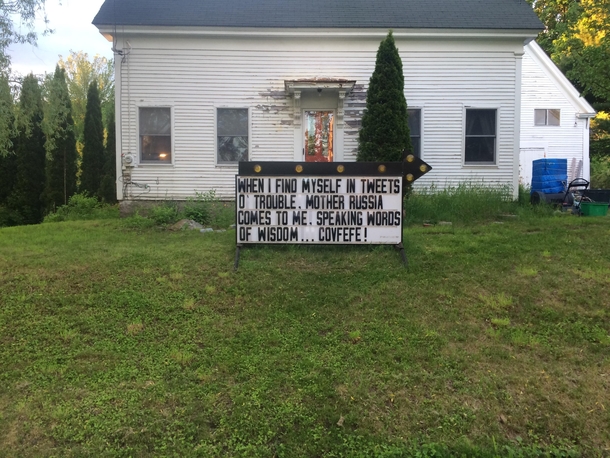 House in my town with sign on lawn Guy changes it daily this is todays