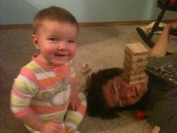Husband fell asleep so daughter and I started playing Jenga on his face