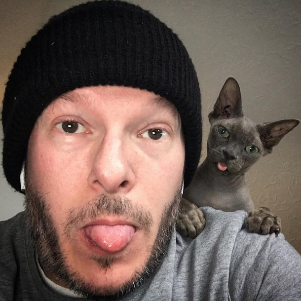 I blep most of the day and im a shoulder cat anyway So this selfie from a few years ago is not at all special but the hooman still wants you to think it is sigh