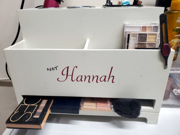 I bought this make up holder from a thrift store My name is not Hannah I asked my husband if he could get creative and cut out new vinyl or somehow cover up the name This was his million dollar idea