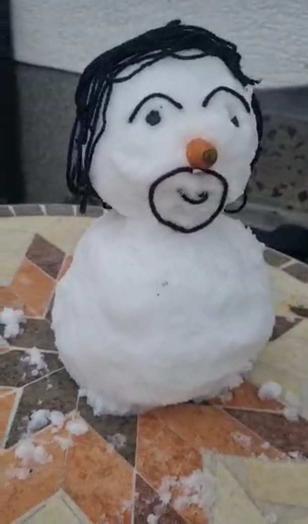 I finally had the opportunity to do something with snow and its my first snowman I tried to make a little version of my uncle failed a bit but Im happy with the result