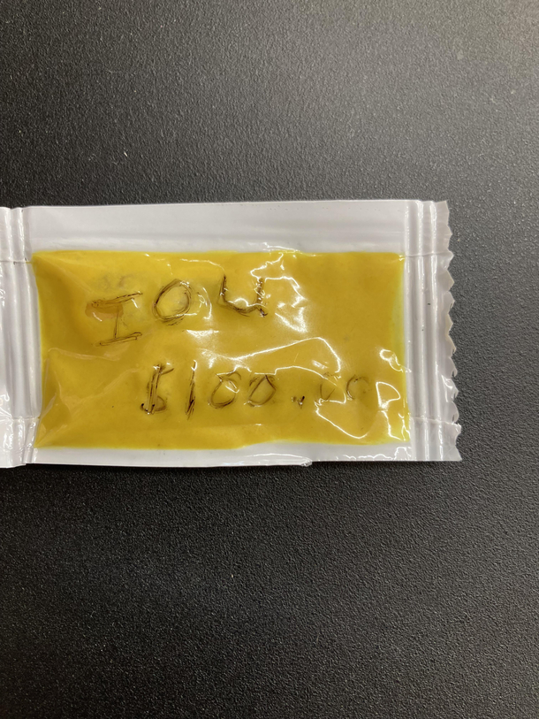 I manage a store and found this IOU  mustard packet in my safe Turned out to be a prank
