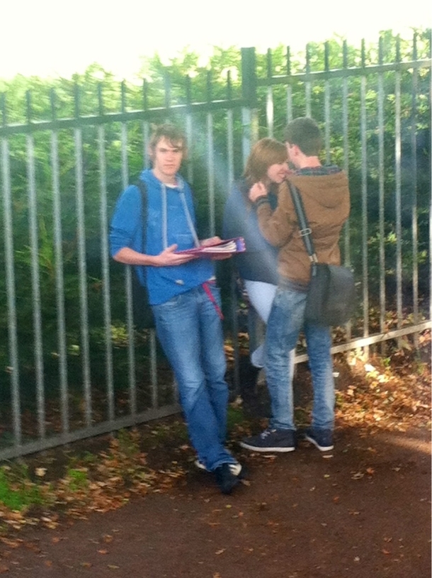 I present to you the king of third wheeling Hes even holding her folders for her