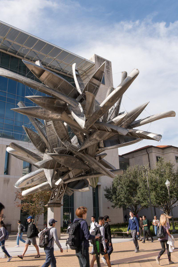 I raise you my university sculpture in front of the engineering building a pile of canoes