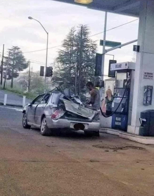 I really hope that is the air hose and his car is going to inflate back into perfect shape
