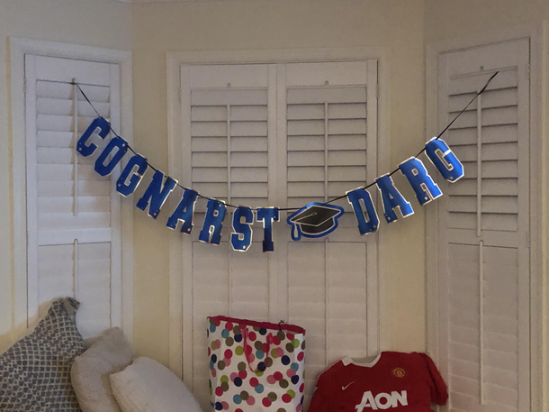 I rearranged the letters on my sis grad banner She was not amused