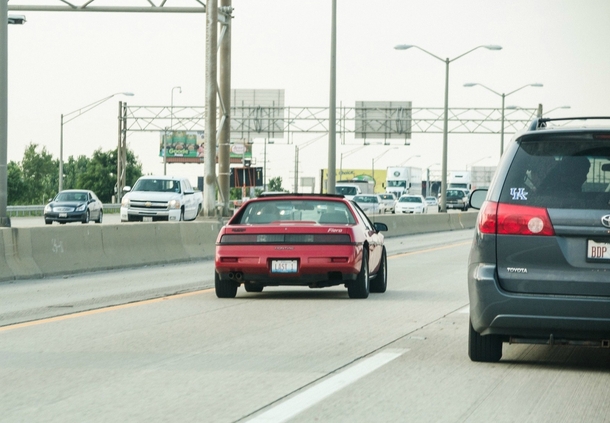 I say wow a fiero they still exist Then I see the plate