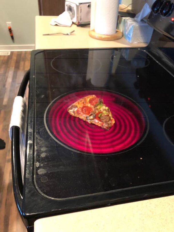 I suggested to my college kid reheating pizza on the stovetop Didnt think I needed to specify in a pan