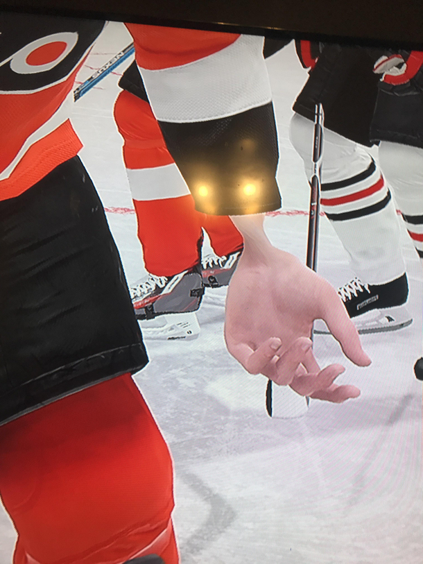 I was playing NHL  and the opposing teams player dropped his gloves This was his wrist