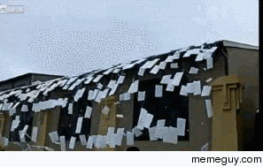 Ice sheets pouring off a building