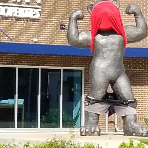 Im not sure how but a local highshool did this to their rivals statue