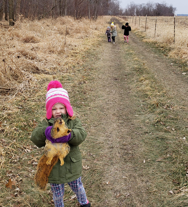 Introducing my middle child please note the  other children playing normally in the distance She found a dead squirrel and was super excited