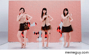 Japanese girls precise dancing through holes in a moving wall