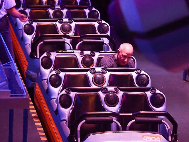 Jeff Bezos riding Space Mountain alone